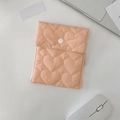 Peach heart-quilted sanitary bag with a white snap button and a woven side label - Heart Quilted Orange Sanitary Bag