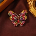 Colorful rhinestone butterfly brooch with golden alloy base and multi-color crystals - Multi-color