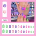 Macro detail of W226 press on nails set with purple and green polka dot patterns - Colorful Dots (W226) / Glue Type