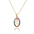Detailed macro view of gold letter Q pendant with multicolored rainbow zircons stones - Letter Q