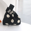 Black and white polka dot knitted tote bag with Stay Hungry text embroidery - Letters On A Black Background With White Dots