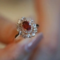Vintage gold ring with oval red gemstone and hollow diamond setting on female hand - Open Adjustable Ring / Rose Gold (Ruby Red)
