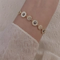 Elegant vintage gold bracelet with round pearls, blue zircon, and white shell inlay - Gold Round Linked Style Bracelet