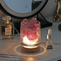 Pink crystal stone aromatherapy lamp with wooden base glowing on a vanity table - Purple Crystal + LED Base + 10ml Oil