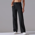 Close-up of high-waist drawstring waistband and functional side pockets on black yoga pants - S / Bottoms / Black