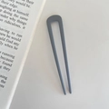 Minimalist U-shaped hair pin in matte grayish blue finish for chic bun styling - Gray