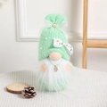 Mint green knitted Christmas gnome with white beard, deer bow, and snowflake charm - Green