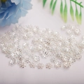 Detailed view of silver flower-shaped spacer beads for DIY jewelry making material - 6mm Hollow Bead Cap / Silver