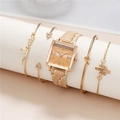 Detail of gold square watch with Roman numerals and matching charm bracelet set - Watch + Bracelet Set / Gold