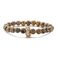 Close-up of tiger eye beads stretch bracelet with a cute beige penguin charm - Yellow Peacock Ore