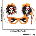 Halloween glasses with orange glitter frames, black pom-poms, and skull decorations - Skeleton Figure Style