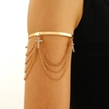 Golden armlet with multi-layer tassel chains and rhinestone cross charms on model - Gold Rhinestone Cross Tassel Style (A-1228)