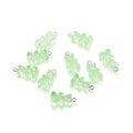 Detailed view of light green gummy bear resin pendants with metal loops for DIY jewelry - Translucent Green