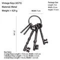 Set of 5 vintage cast iron decorative keys in rustic bronze finish with size specs - 6575 Five Keys with Ring