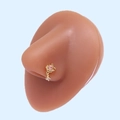 Detail of gold planet nose stud with pink zircon and star charm on a display model - Gold Planet Pink Zirconia (#18)