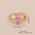 Adjustable golden ring featuring pink heart and teardrop zircons on light beige background - 2# Heart Water Drop