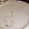 Silver butterfly flower necklace featuring asymmetric chains with a white pearl and tassel - Pearl Crushed Silver Pull-out Tassel Necklace - Triangle