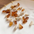 Detail of amber and cream resin beaded earrings displayed on a white ceramic tray - 12# Silver Needle-Coffee-Beige-Large