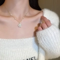 Detailed view of camellia flower necklace with gold chain and pearls on a collarbone - 38# Necklace-Gold