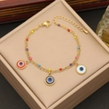 Double-layered gold necklace featuring colorful beads and evil eye charms on a jewelry box - 2# Bracelet
