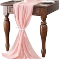 Pink chiffon table runner with elegant drape tied with a white ribbon on wood table - Baby Pink
