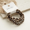 Detailed view of three braided hair ties in coffee, brown, and cream tones on a display card - Brown