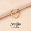 Macro view of a 15.2x17.4mm golden heart pendant on pink silk with product dimensions - Gold