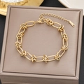 Elegant gold titanium steel link bracelet with knot details on a premium jewelry box - Gold Long Oval Link Style (5243)