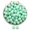 Mint green round acrylic beads with iridescent luster for DIY jewelry making - Green