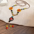 Bohemian colorful beaded necklace with geometric rings and woven ethnic details - Style 15 Ceramic Bead Long Woven Cord Pendant Necklace