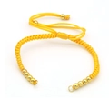 Detailed view of yellow hand-woven adjustable cord bracelet with golden beads - Yellow