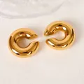 Detailed view of hollow C-shaped ear clips with 18K gold plating and polished finish - 18K Gold