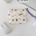 Close-up of quilted floral coin purse with Bread Dog pattern and purple zipper pull - Bread Doggy