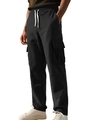 Detail of men's black corduroy cargo joggers with drawstring waist and large flap pockets - S / Black
