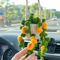 Handmade crochet hanging car plant ornament with green leaves and orange flowers - White Basket + Orange Flowers