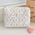 Macro detail of the quilted floral toiletry bag featuring pink roses and bow patterns - Rose Bow [Clutch Bag]