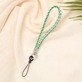 Detail of green and cream woven phone wrist strap with silver metal connectors - Vibrant Green