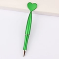 Green heart-shaped ballpoint pen with polished silver metallic tip on white surface - Heart / Green