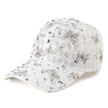Close-up of white lace baseball cap featuring silver rhinestones and butterfly patterns - Beige