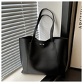 Detail of minimalist black PU leather tote bag with thin straps and metallic accent - Black
