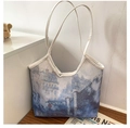Detail of artistic oil painting print canvas tote bag on a minimalist wooden surface - Style 5 (Blue and White Landscape)