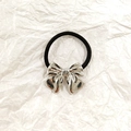 Elastic ponytail holder with a metallic silver hollow bow decoration on a white background - Silver Butterfly 3.5cm
