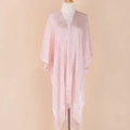 Detailed view of pink knitted shawl featuring elegant long tassels and shimmer fabric - Pink