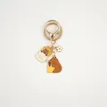 Detail of metal capybara keychain with enamel fries and flower charms on a golden ring - Capybara Eating Fries With Flower (Capybara#08)