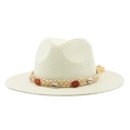 Detail of woven straw sun hat featuring decorative sea shells and tassel embellishments - M (56-58cm) / Creamy White