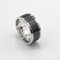 Macro detail of wide stainless steel ring with black layered grooves and silver finish - US 9 / 5-Line Black Oil