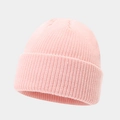 Close-up of pink knit beanie showing detailed vertical ribbed texture and folded cuff - One Size / Hot Pink