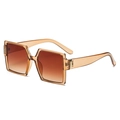 Retro oversized square sunglasses featuring champagne amber frames and gradient brown lenses - Transparent Tea Frame Gradient Tea