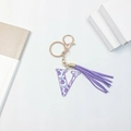 Fashionable keychain with floral letter V charm and purple tassel on white background - Letter V (With Tassel)