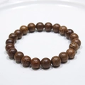 Macro shot of dark brown wenge wood beaded bracelet with natural black grain patterns - 21# (Wenge Wood Texture)